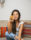 Woman smiling holding a cookie
