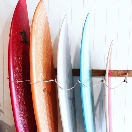 Surfboards leaning against the wall