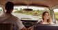 Couple exploring Laguna Beach in a car