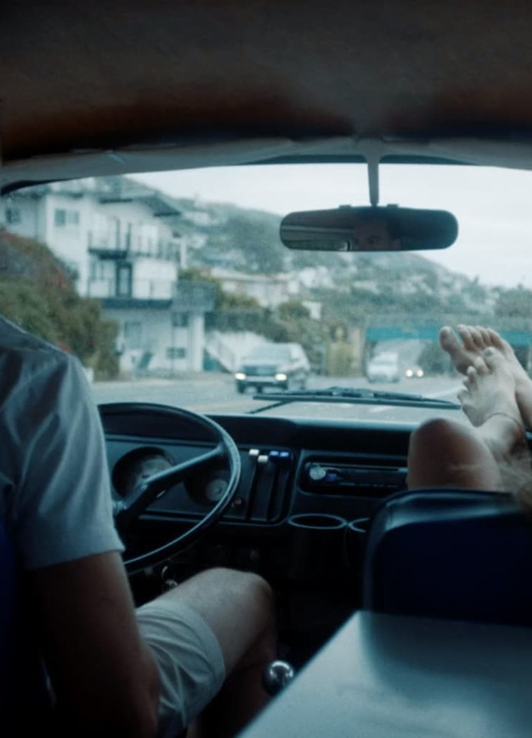 Couple exploring Laguna Beach in a car